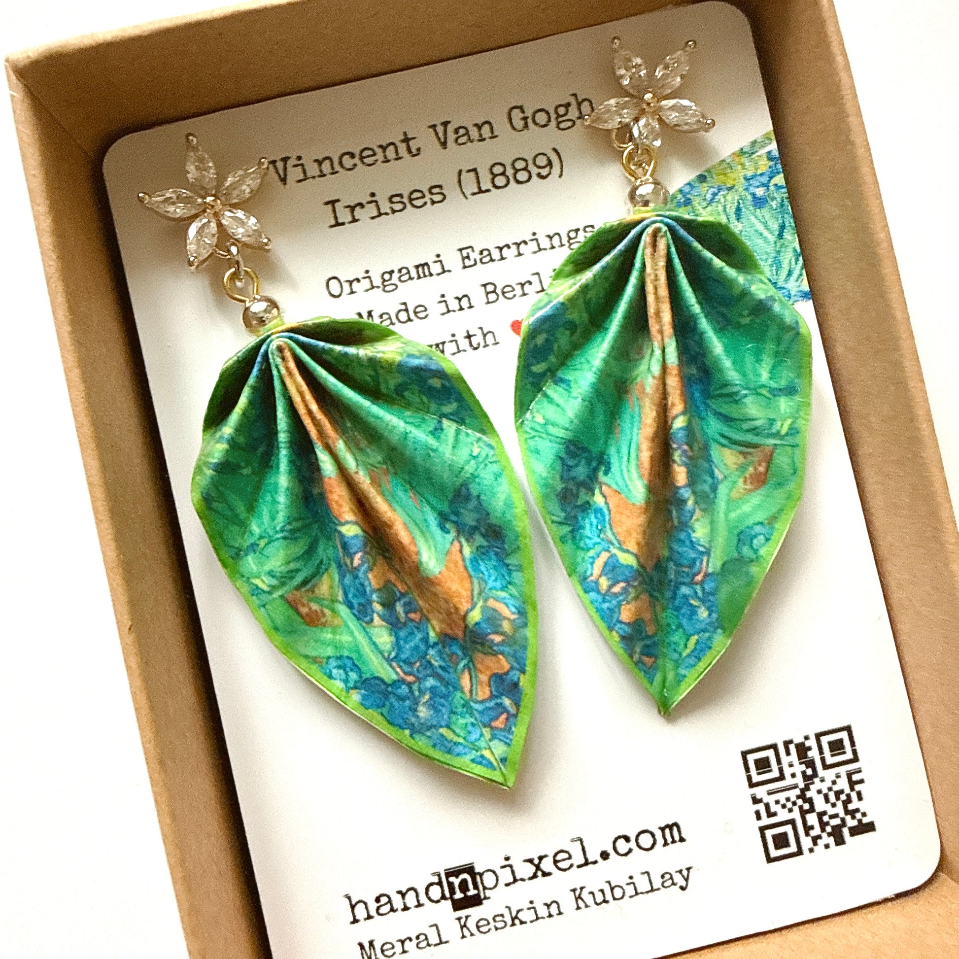 Origami earrings with floral design on a branded card