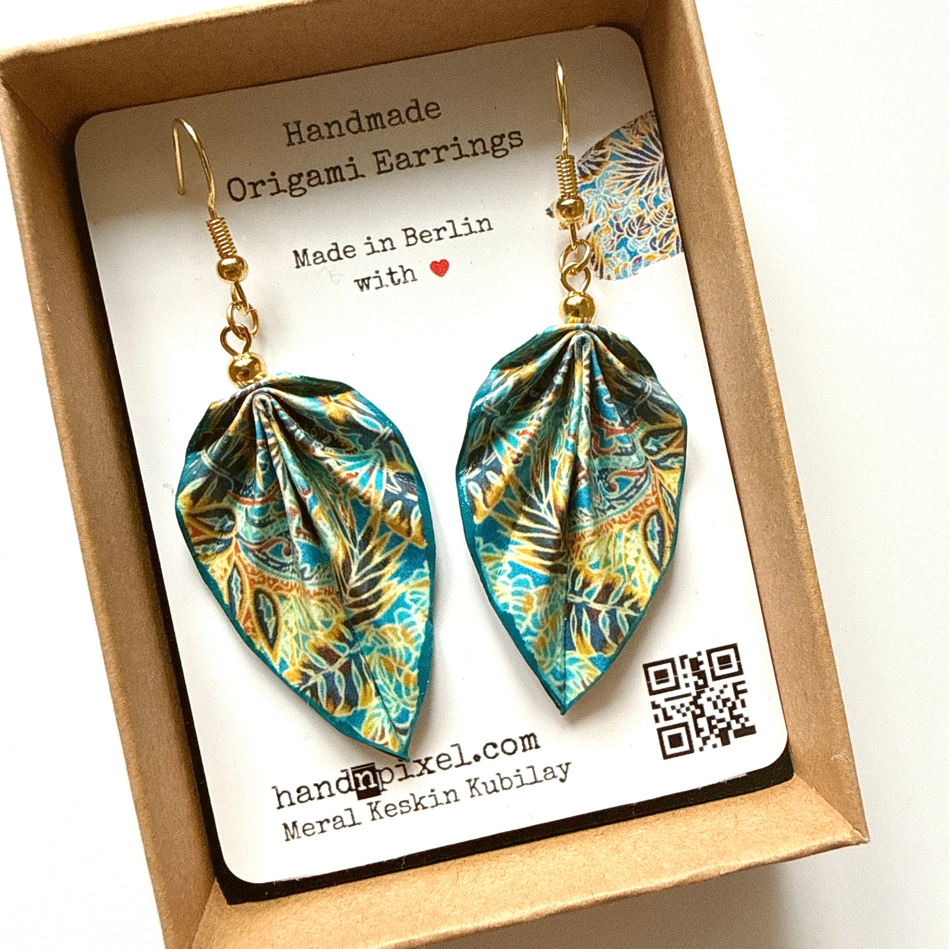 Handmade origami earrings in a box with a label